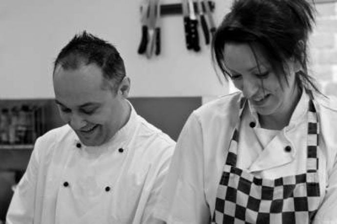 Alison and Danilo Tozzi from Just So Italian cooking together in the kitchen