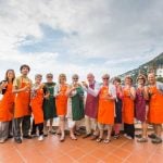 Group of single travellers raising their glasses