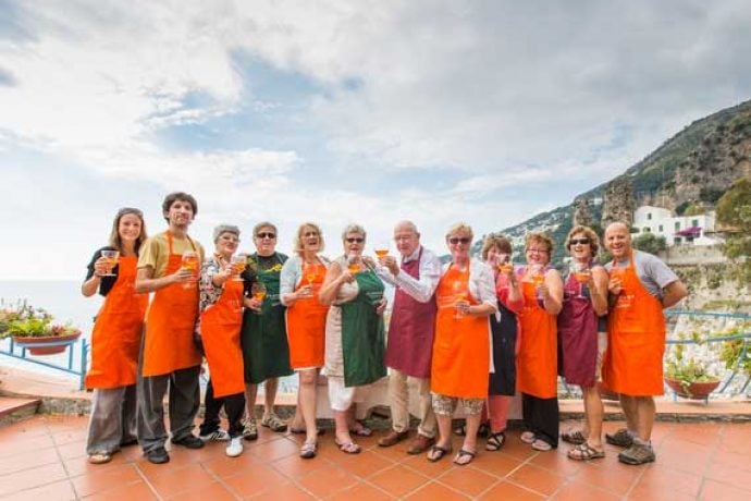 Group of single travellers raising their glasses