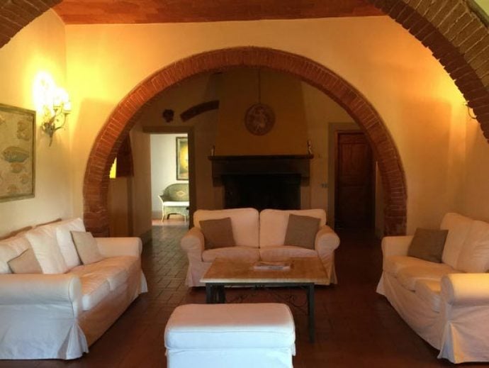 Cozy lounge in rustic Tuscan holiday villa.