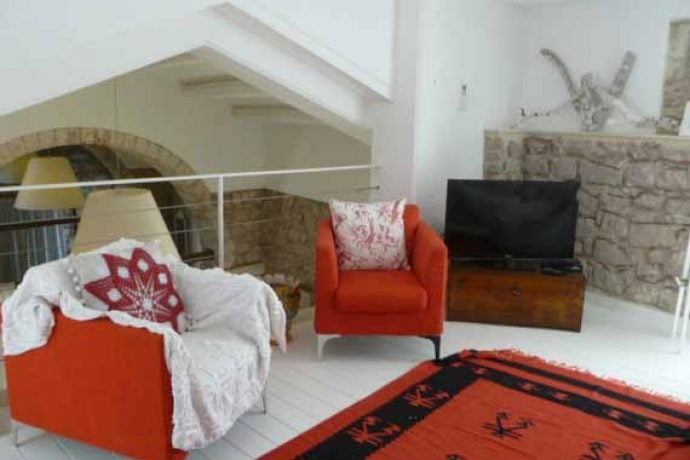 Stylish red furniture in our painting holiday venue in Sicily