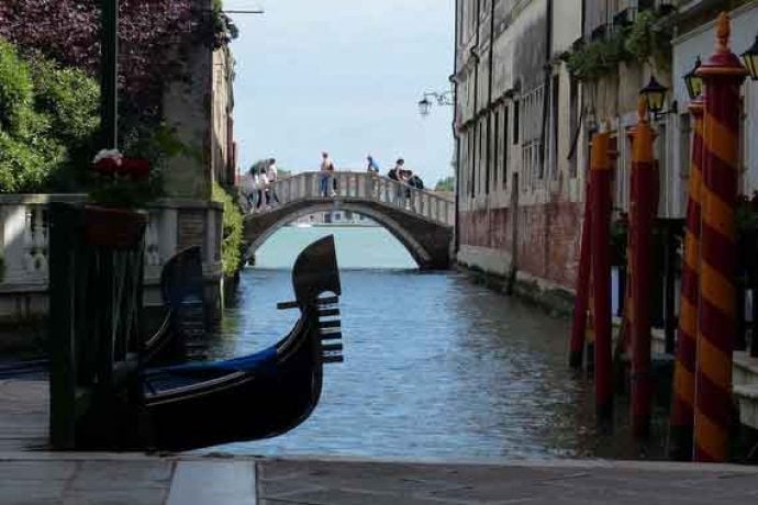 Canal, gondola and buildings in Venice.