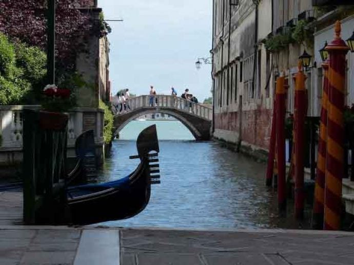 Canal, gondola and buildings in Venice.