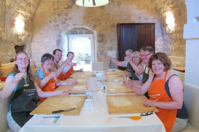 Happy guests during cooking lessons in Sicily.