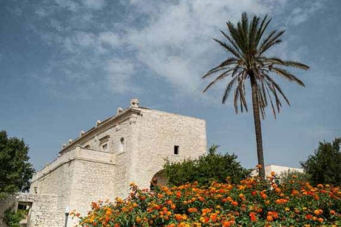 The stylish exterior of our venue in Sicily, with stone walls.