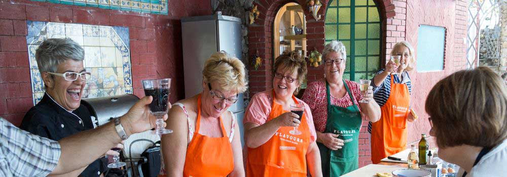 Cooking lessons on Italian holiday with delicious wine and laughter