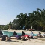 Pilates students relaxing by the pool after tailor-made class