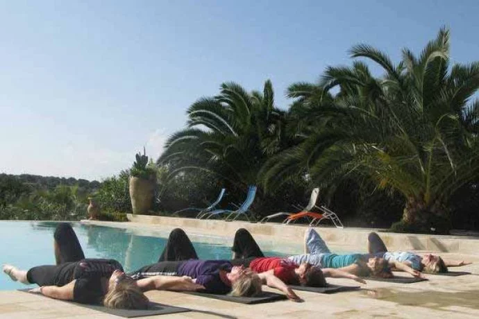 Pilates students relaxing by the pool after tailor-made class