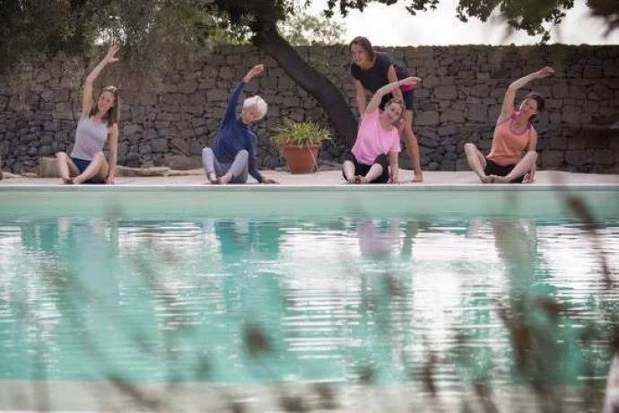 Pilates in Sicily by the pool.