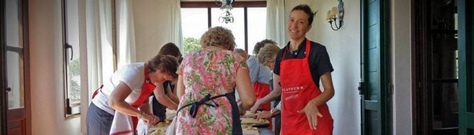 Italian host livia teaching cookery guests during lessons in Tuscany