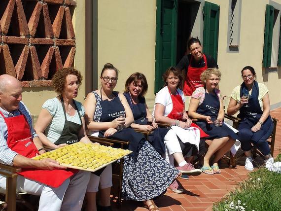 Cooking group outside in Tuscan sunshine. Cooking group outside enjoying Tuscan sunshine and Prosecco.