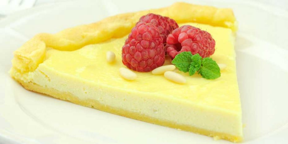 Delicious Ricotta Tart served with pine nuts and rasberries
