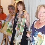 Painting guests exhibiting their art work from Italian holiday