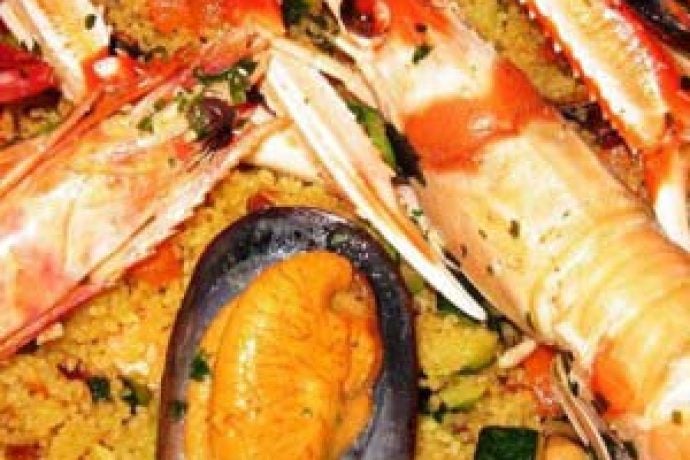 Delicious plate of couscous served with fresh seafood