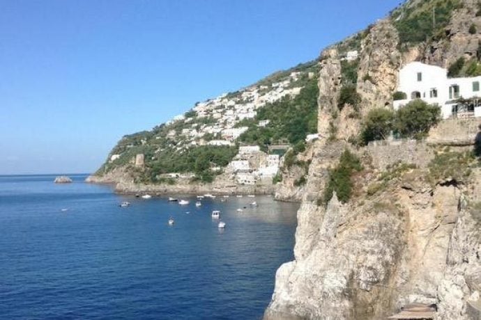 Amalfi coast with blue sky and dramatic cliffs