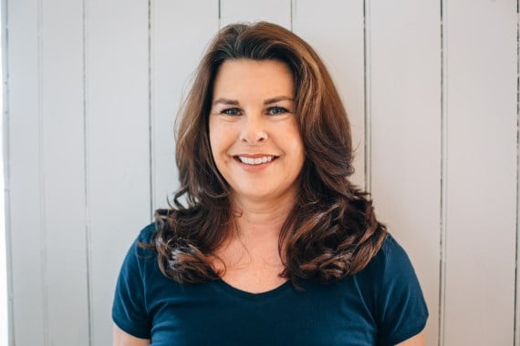 Pilates instructor, Diane Parrilla. Diane Parrilla, the Pilates instructor in studio on mat exercising Pilates