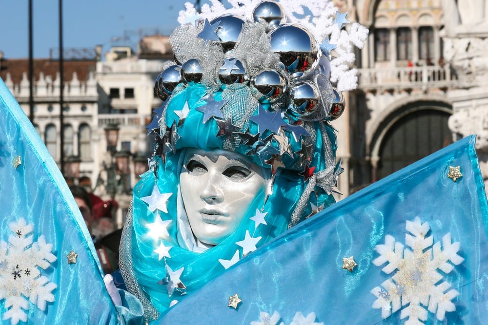 Person dressed up in costume and mask for Venice Carnival 