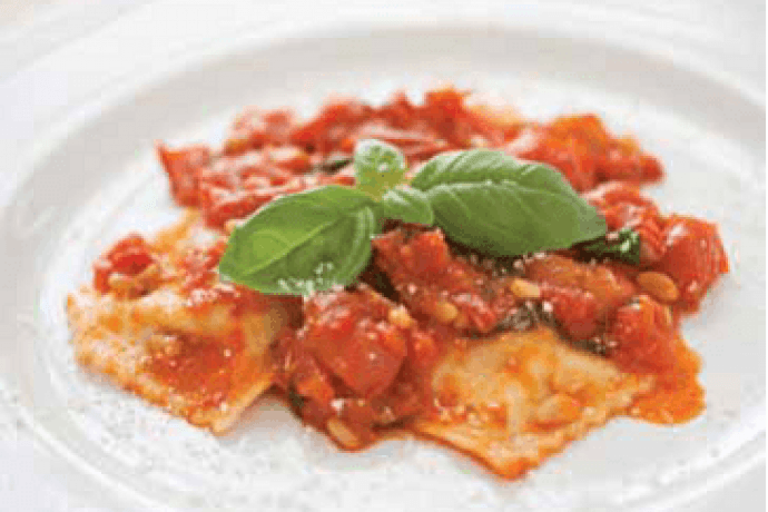 Ravioli di Ricotta, in a tomato sauce on a white plate