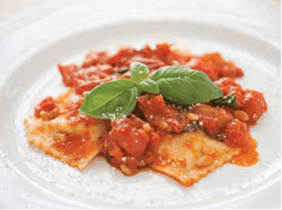 Ravioli di Ricotta, in a tomato sauce on a white plate