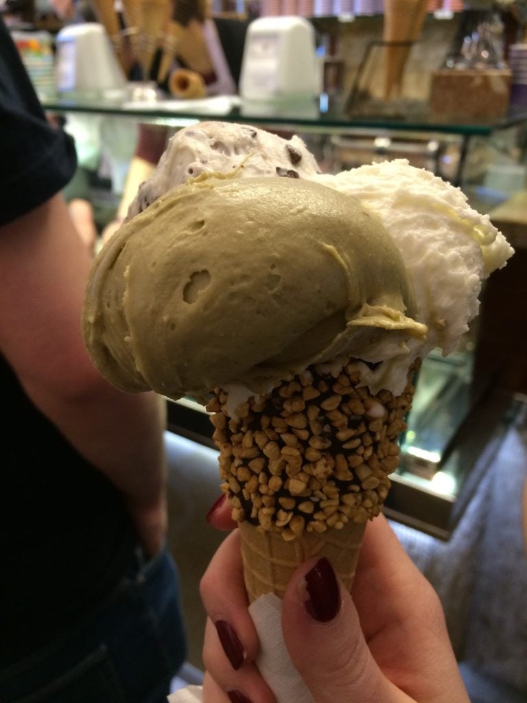 Ice cream cone with three scoops of ice cream at Gelateria Dondoli