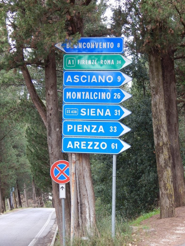 Italian road signs showing distances between different cities