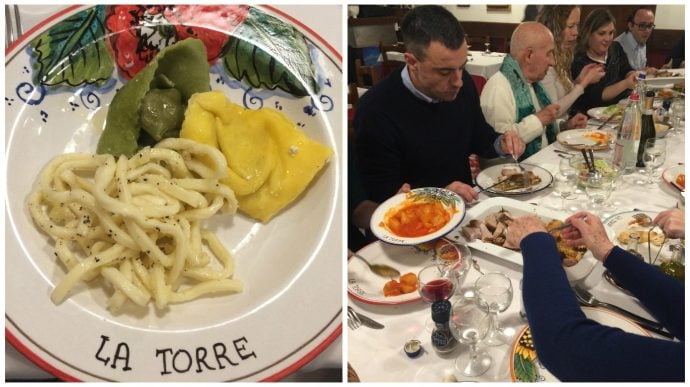 Shows dinner table with people enjoying food and drink