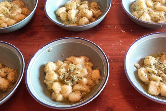 dish of gnocchi with a pesto sauce