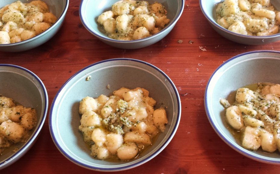 dish of gnocchi with a pesto sauce