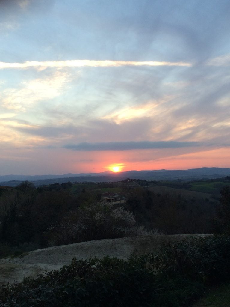 Sun setting over a Tuscan landscape