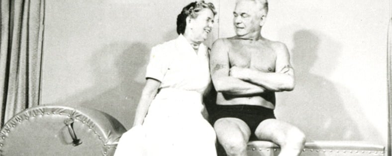 Joseph and Clara Pilates looking admiringly at each other 