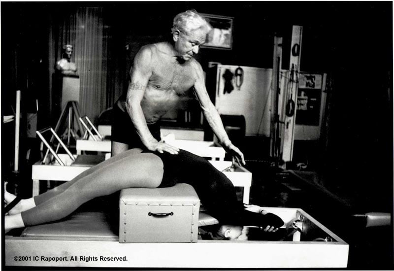 Joseph Pilates helping a student