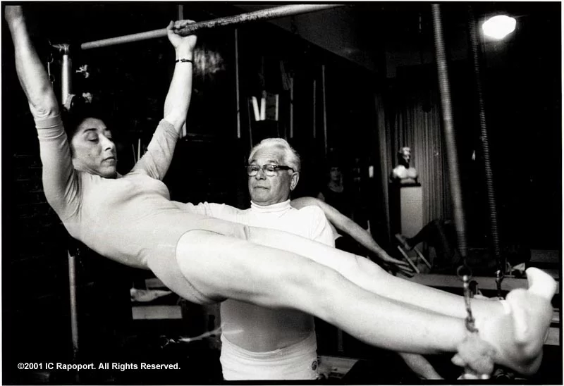 Joseph Pilates instructing a student