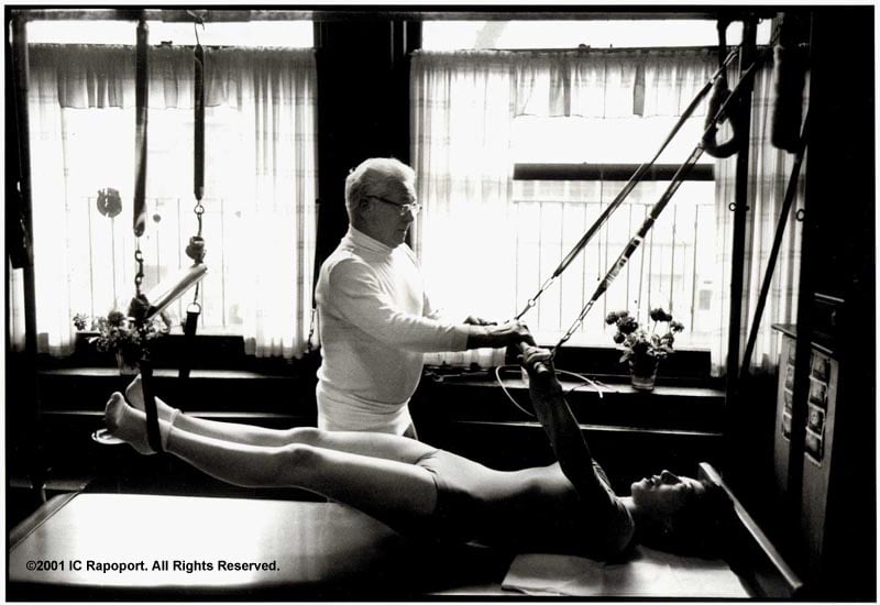 Joseph Pilates working with a student