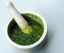 Green pesto in a pestle