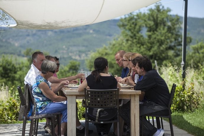 group eating outdoors in Tuscany