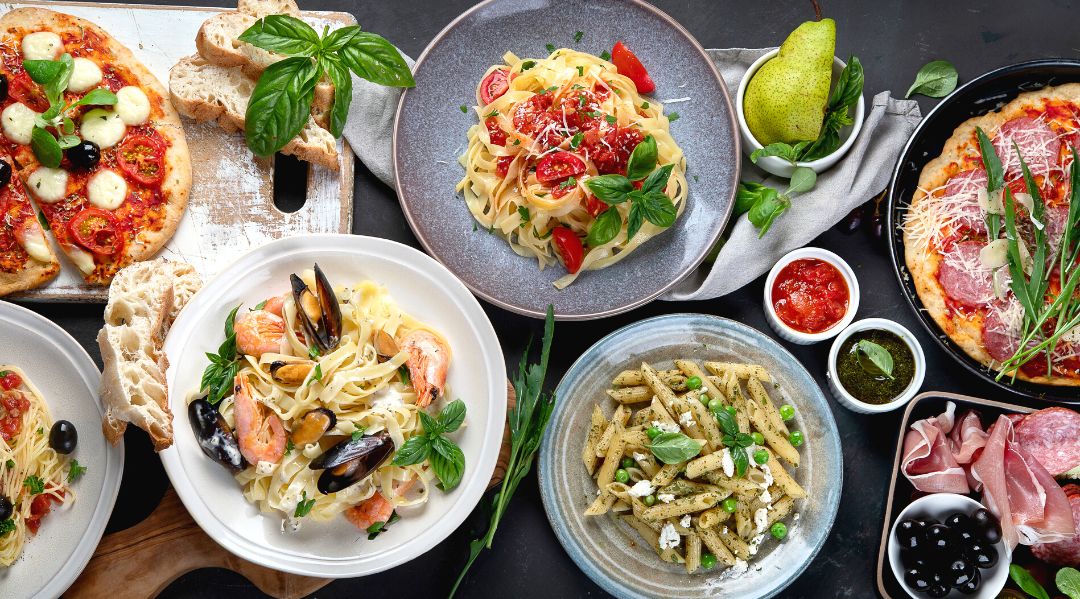 A table full of Italian dishes 