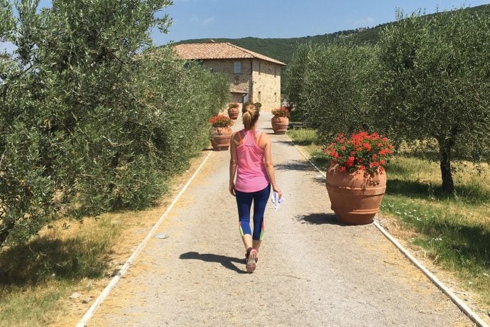 Pilates and mindfulness lady walking towards villa