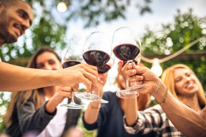 Friends toasting with red wine