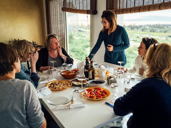 Group of friends enjoying a meal in Italy