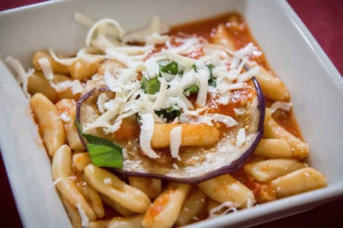 Recipe for Pasta Alla Norma made with casarecce pasta and ricotta salata.