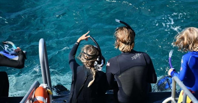 Family by the water going snorkelling