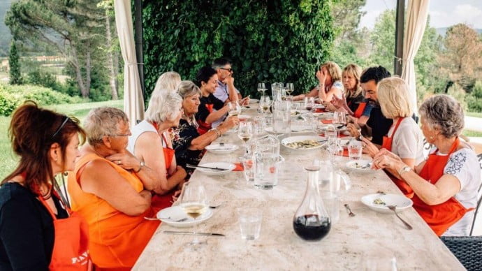 Italian dinner party in Bologna with people discussing their day