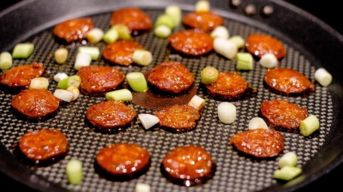 Pepperoni cooking in a frying pan