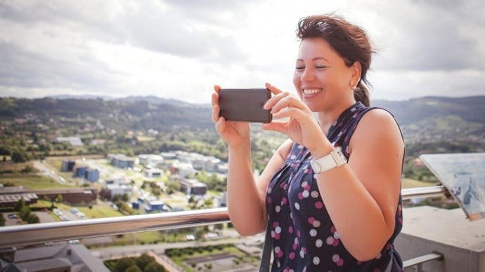 a solo traveller taking a picture of a beautiful location