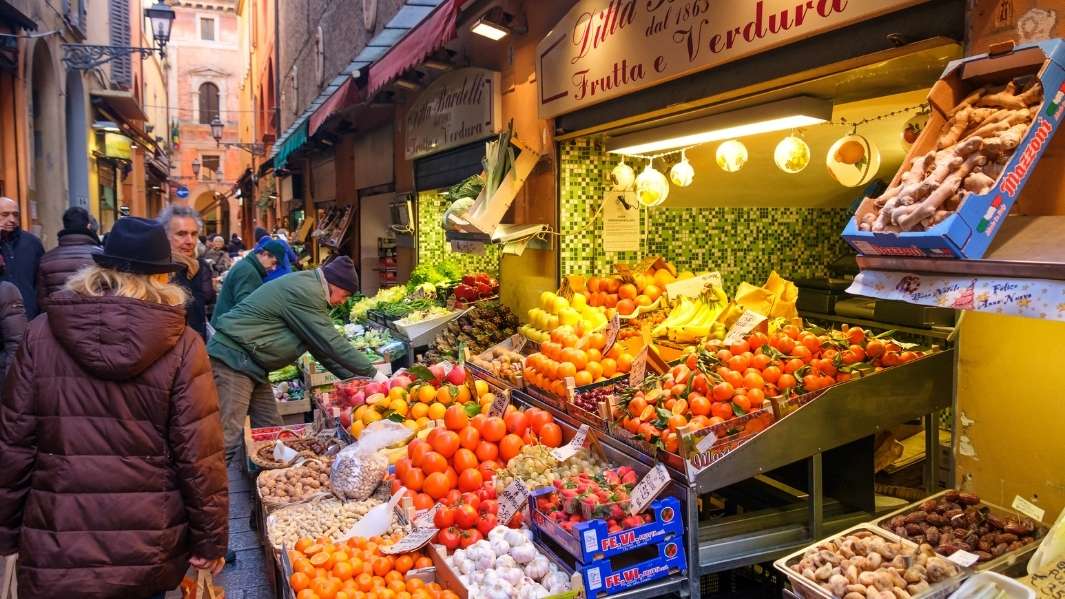 An Italian farmers market with fresh fruit, vegetables and other produce