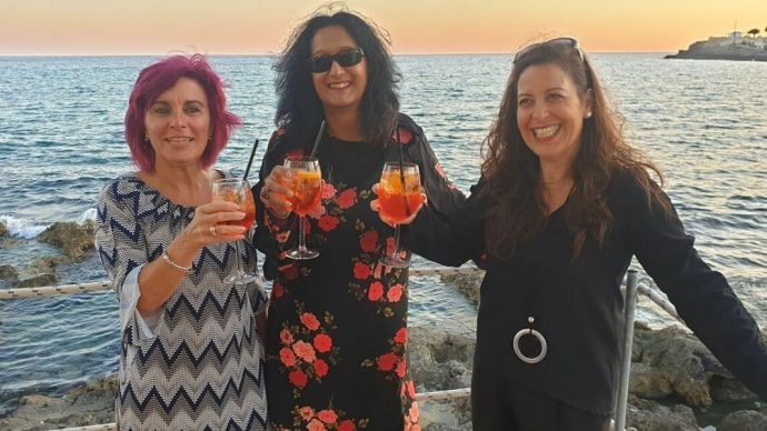 Women enjoying a glass of Aperol Spritz in Italy