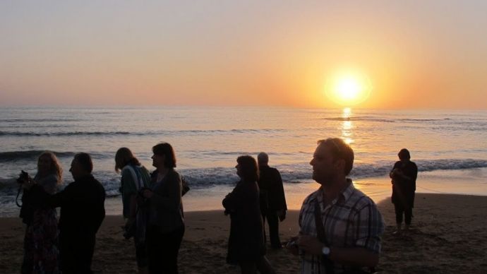 Group holiday on the beach taking in the beautiful scenery