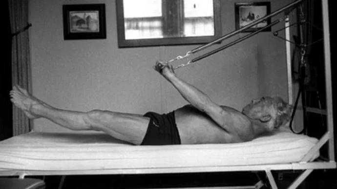 Joseph Pilates using Pilates machines that he invented Joseph Pilates using machines to workout