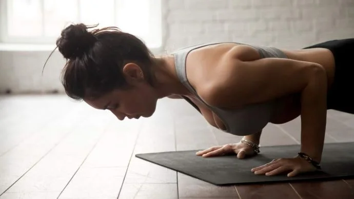A girl practicing pilates and focusing on strength A girl practicing pilates and focusing on strength