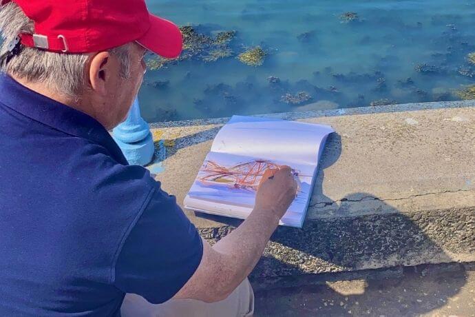 Mark Holden teaching a painting lesson